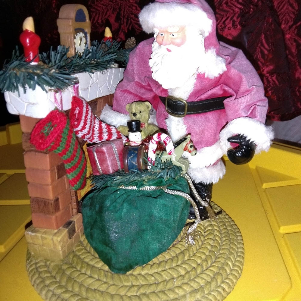 Traditions Holiday Decor Santa standing by the chimney with bag of gifts